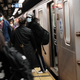 People (and countless microbes) at a New York City subway station on April 13, 2021 .